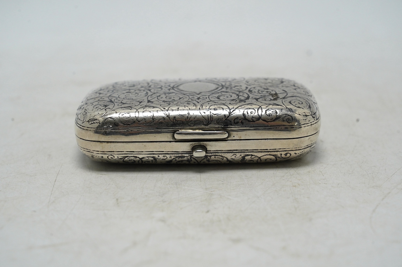 A late 19th century Russian 84 zolotnik and niello ovoid snuff box, Moscow, 1879, 96mm, gross 104 grams. Condition - poor to fair